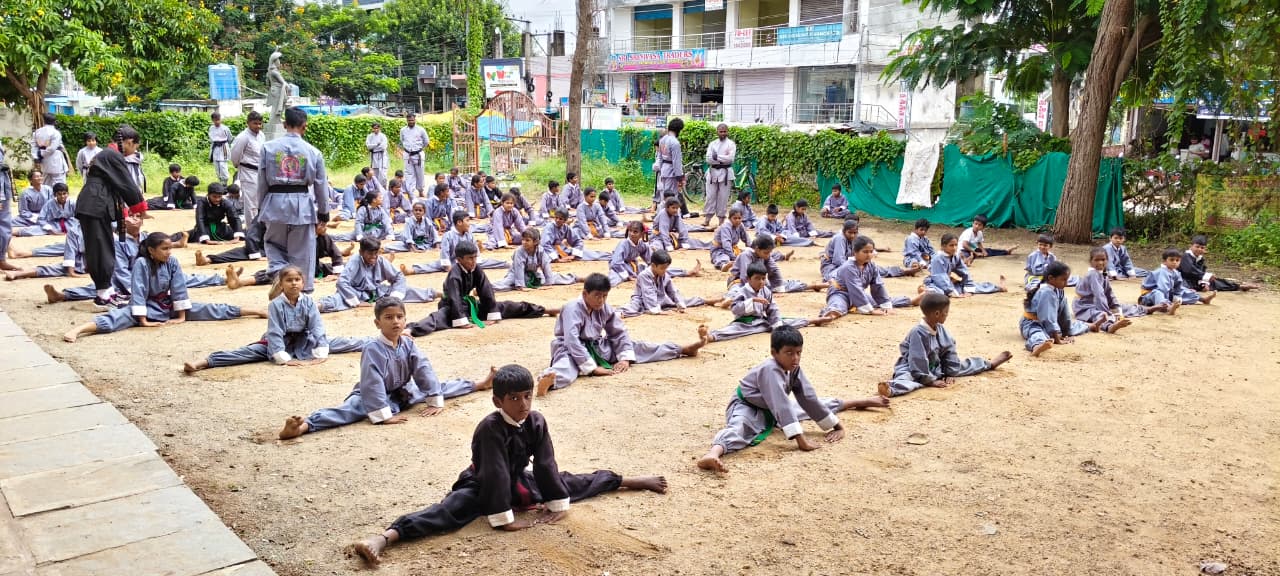 School martial arts training — certified coach with students